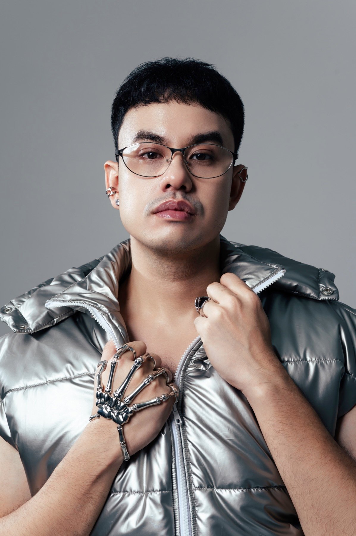 Portrait of Ananta Vinnie in a metallic silver jacket